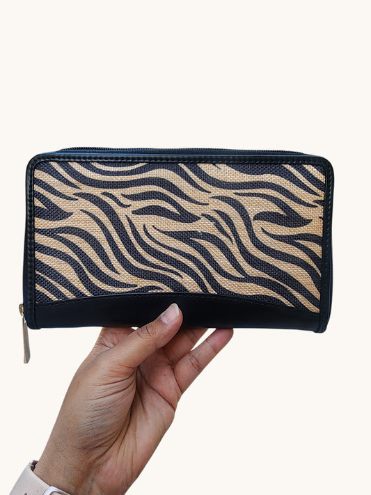 Cannish Pitara Carrie wallet featuring a black and beige zebra print fabric design with a secure zip closure.